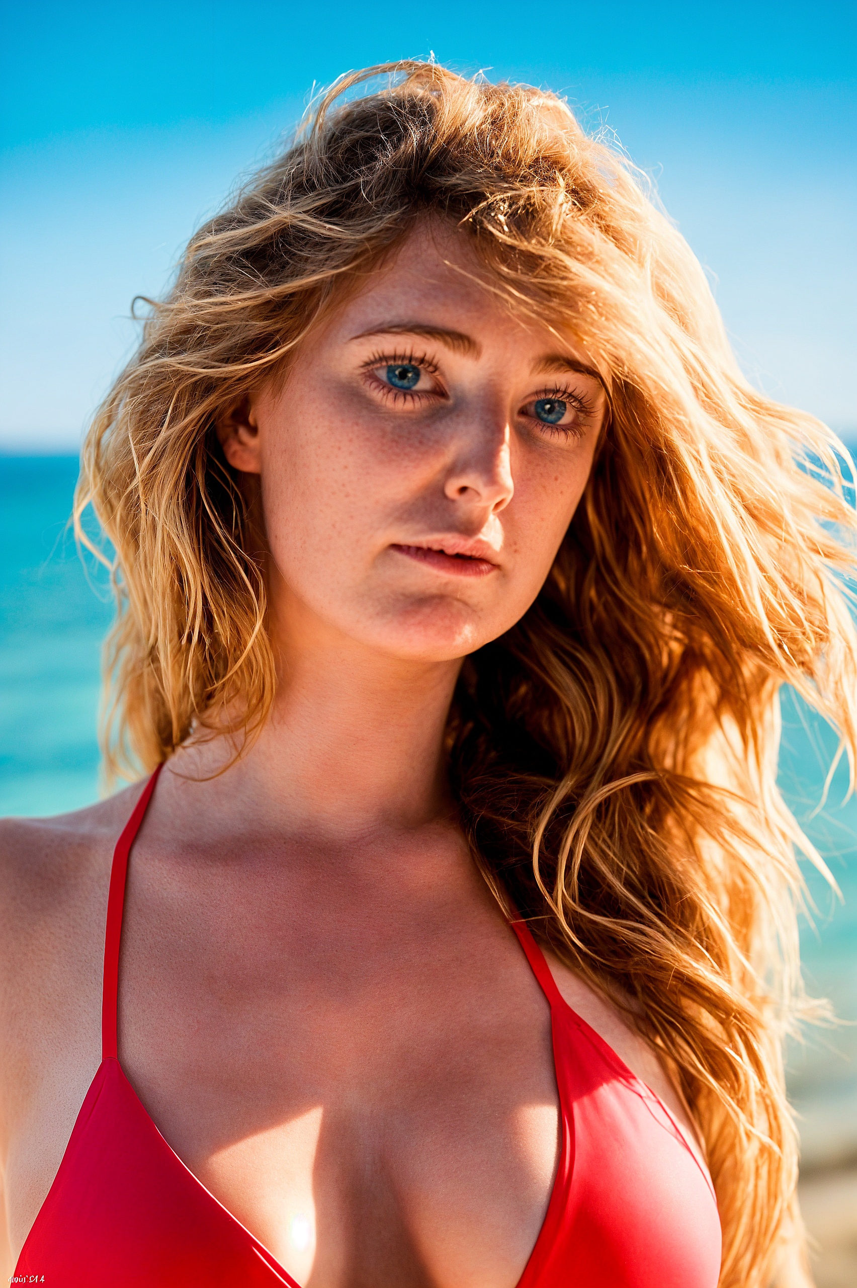 a woman in a red bikini top on the beach fig 4