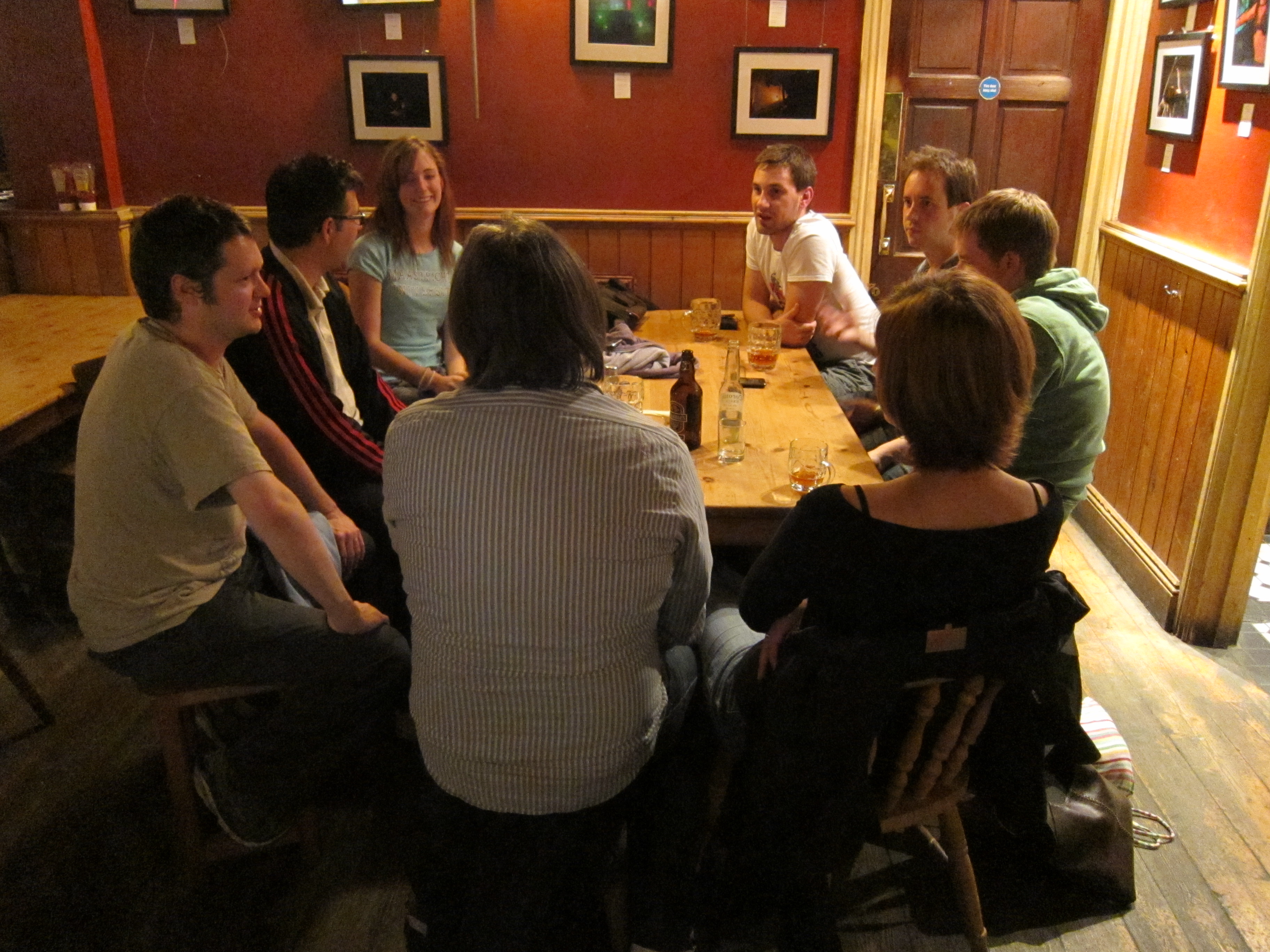 a group of people sitting around a table