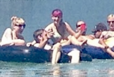 a group of people in a boat in the water