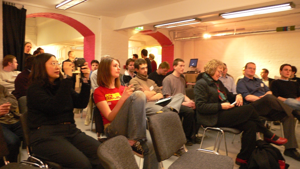 a group of people sitting in chairs in a room