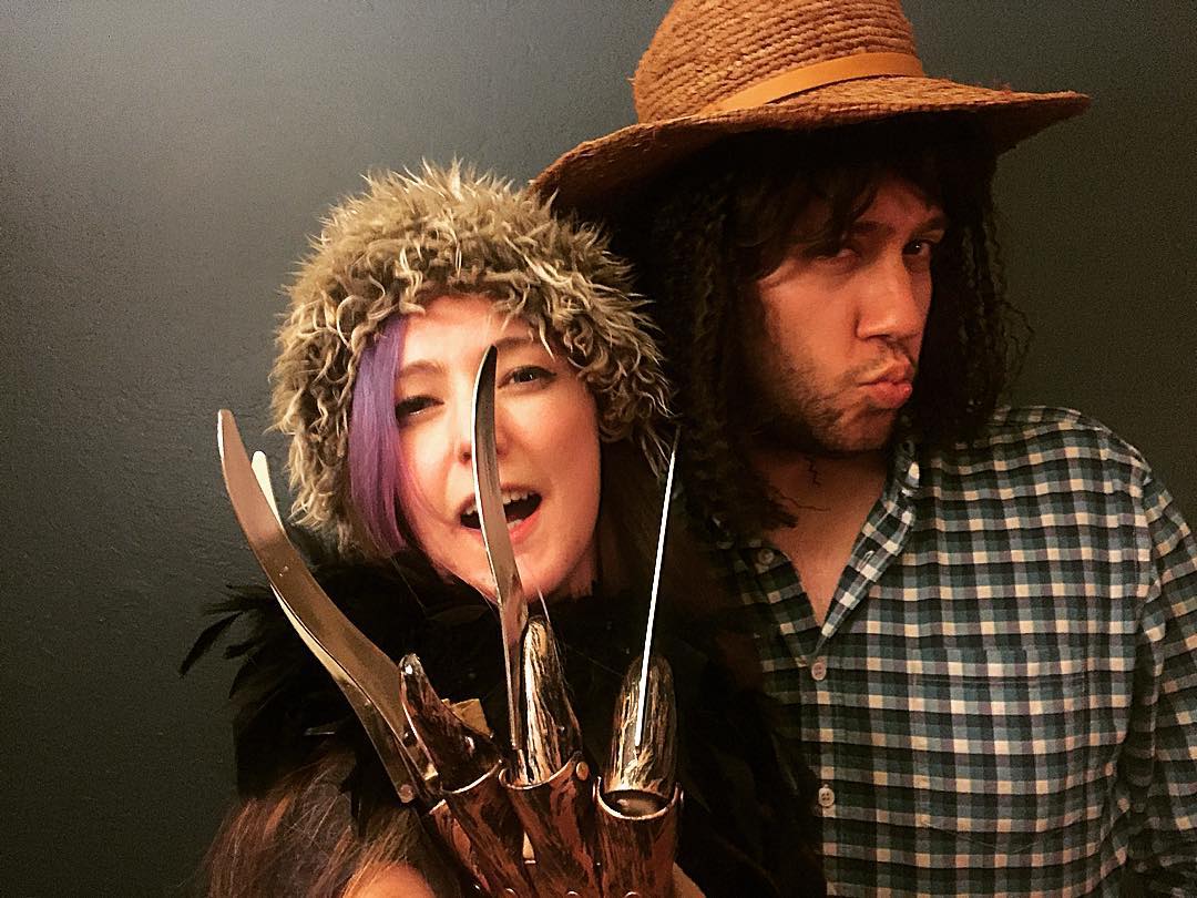 a man and woman wearing costumes and hats ee a

.
Ll ax ies bea
fe