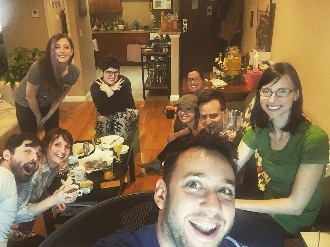 a group of people sitting around a table