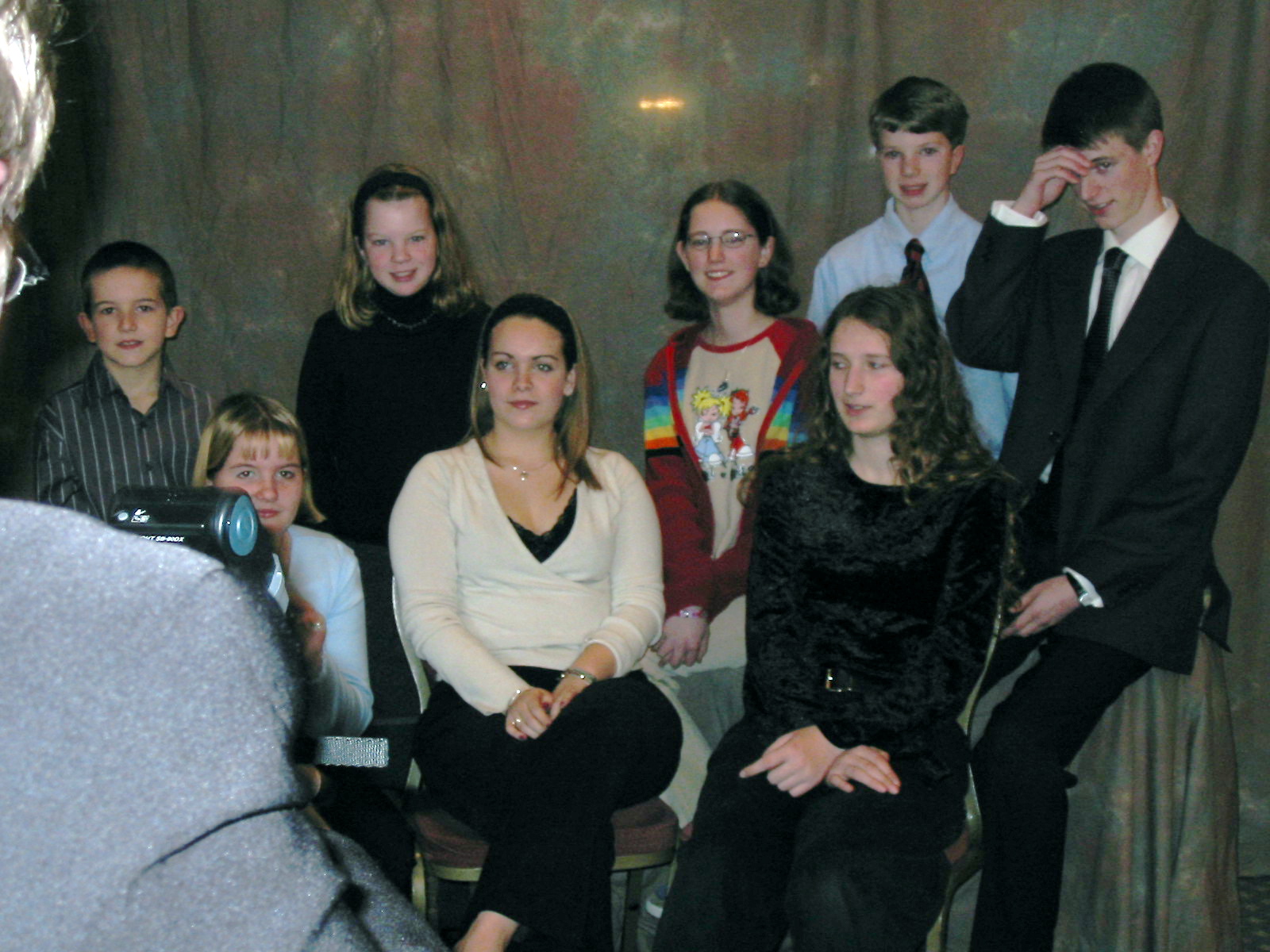 a group of people sitting on a chair