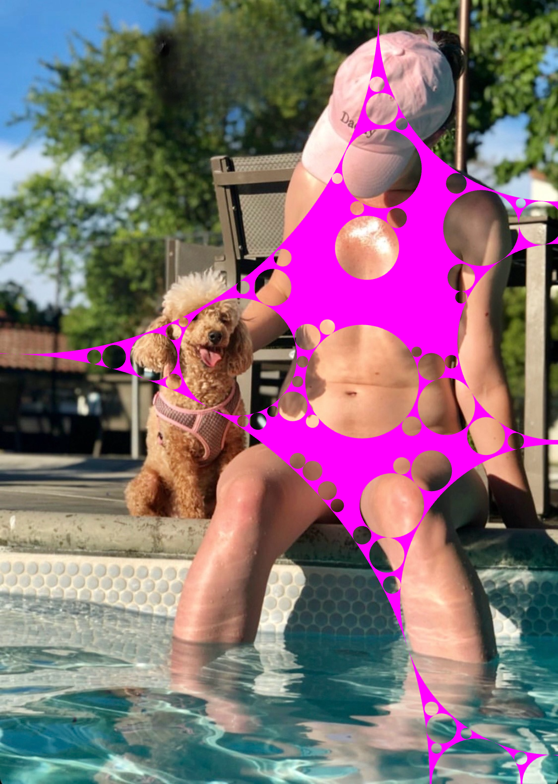 a woman in a pink bikini and a dog