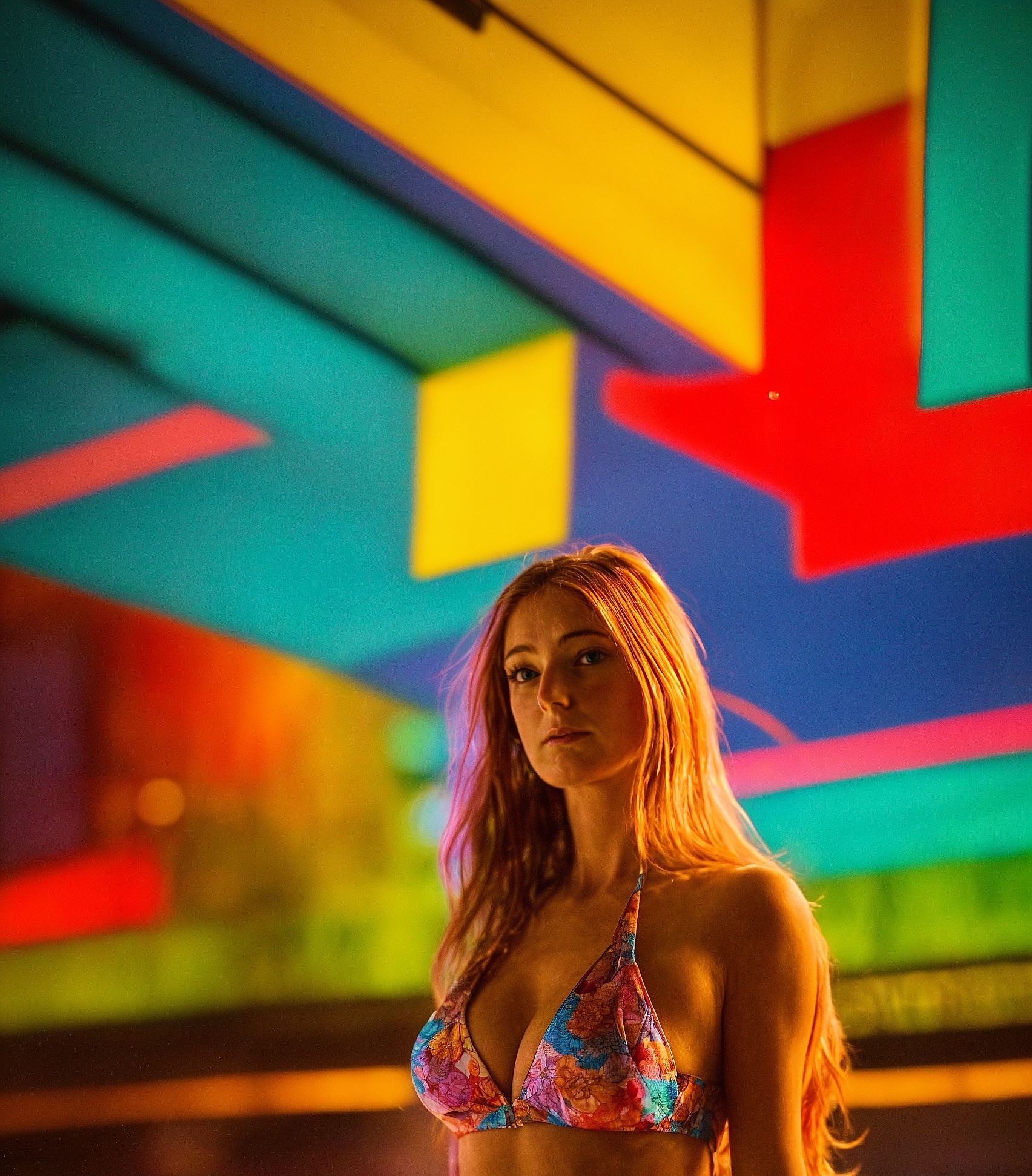 a woman in a bikini top and a surfboard