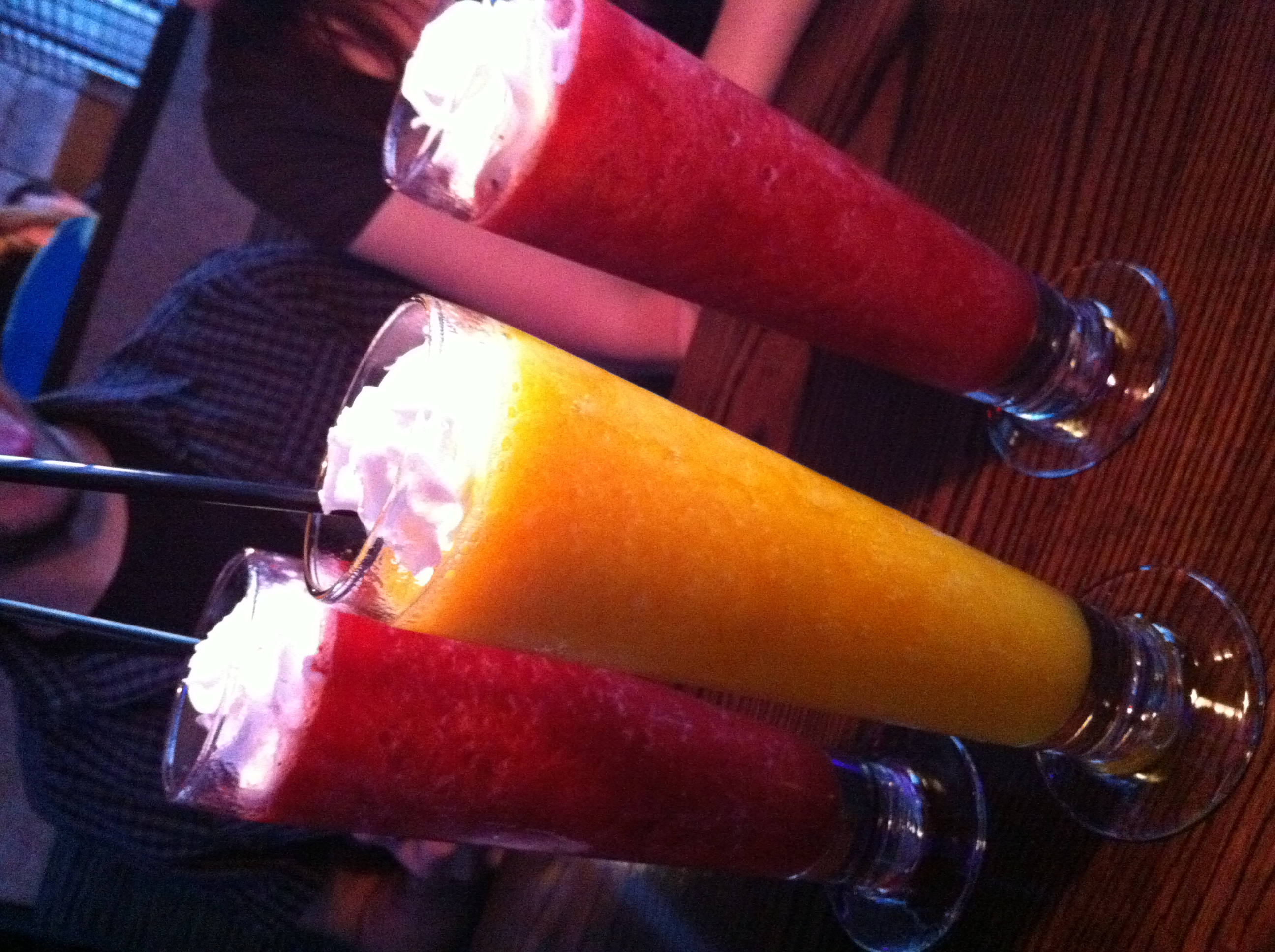 a couple of glasses with a dessert on them