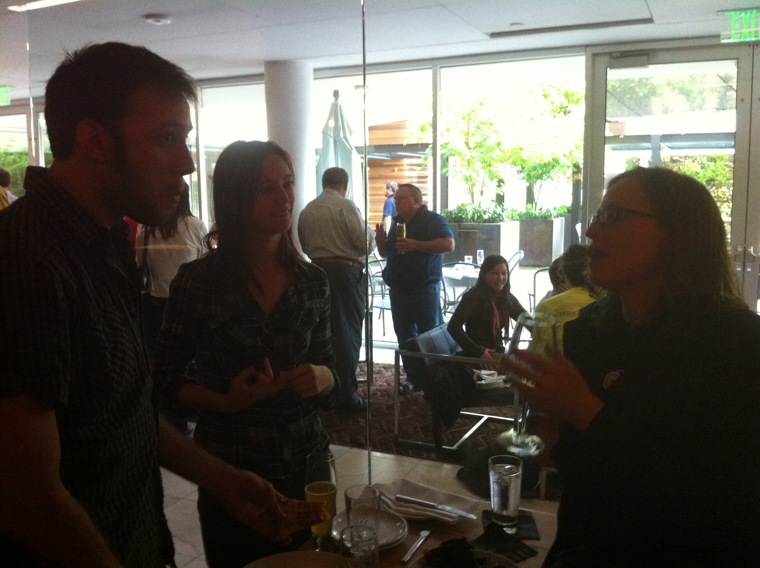 a group of people are gathered around a table