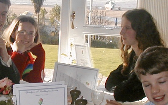 a group of people sitting around a table