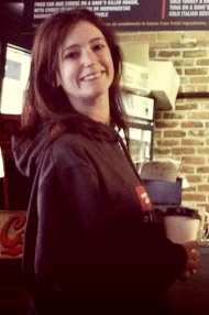 a woman standing in front of a counter