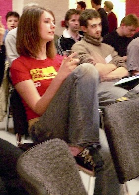 a group of people sitting in chairs in a room