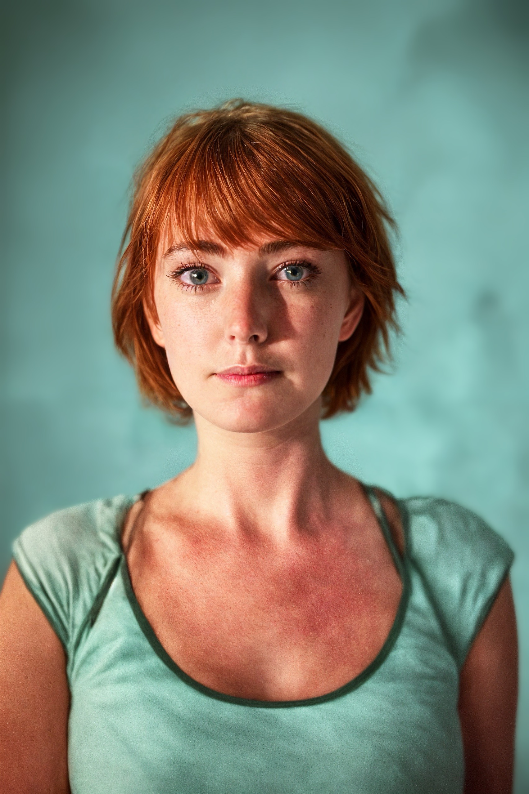 a woman with red hair and blue eyes