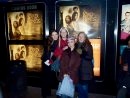 a group of people standing in front of a display