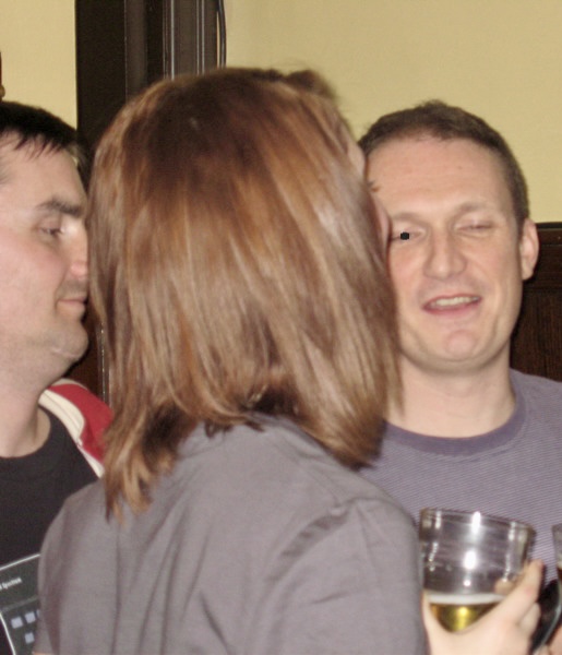 a group of people are gathered around a table