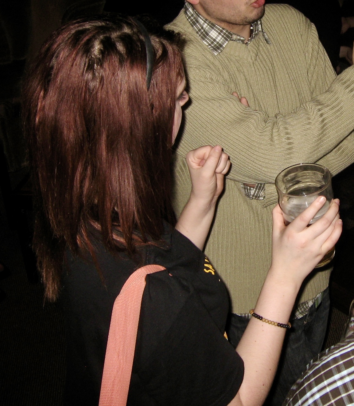 a man in a brown sweater