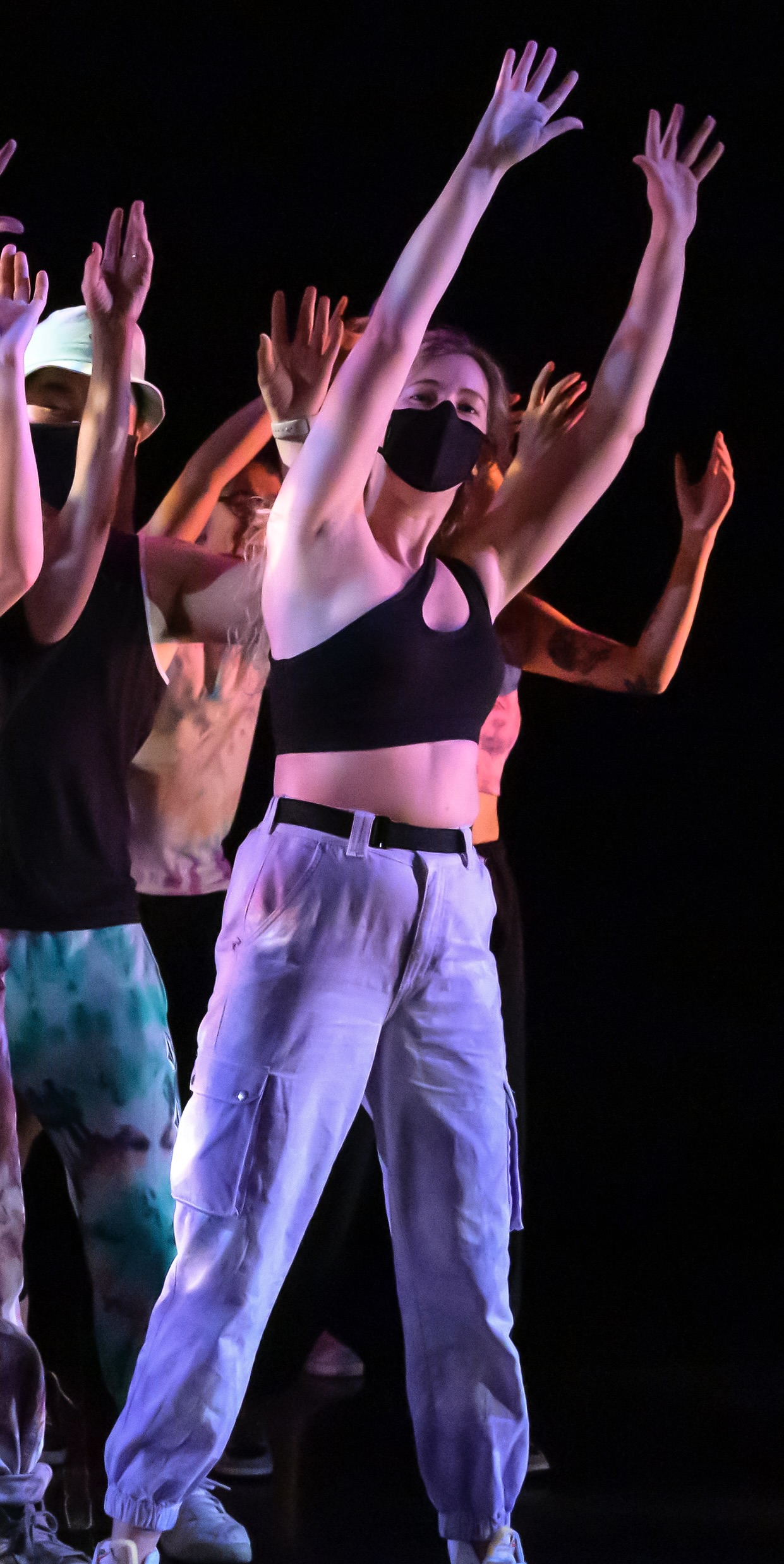 a group of people dancing on a stage