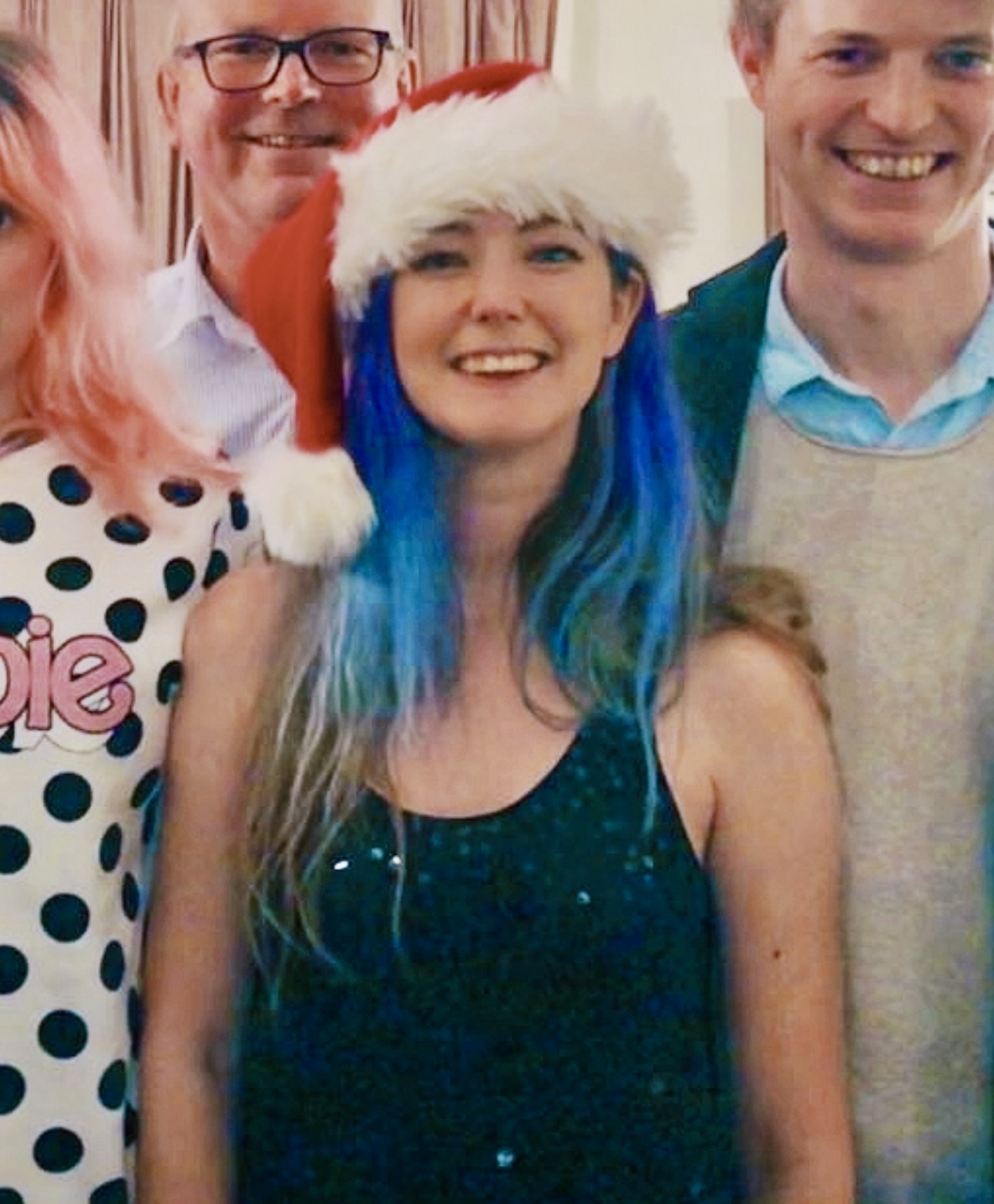 a group of people wearing christmas hats