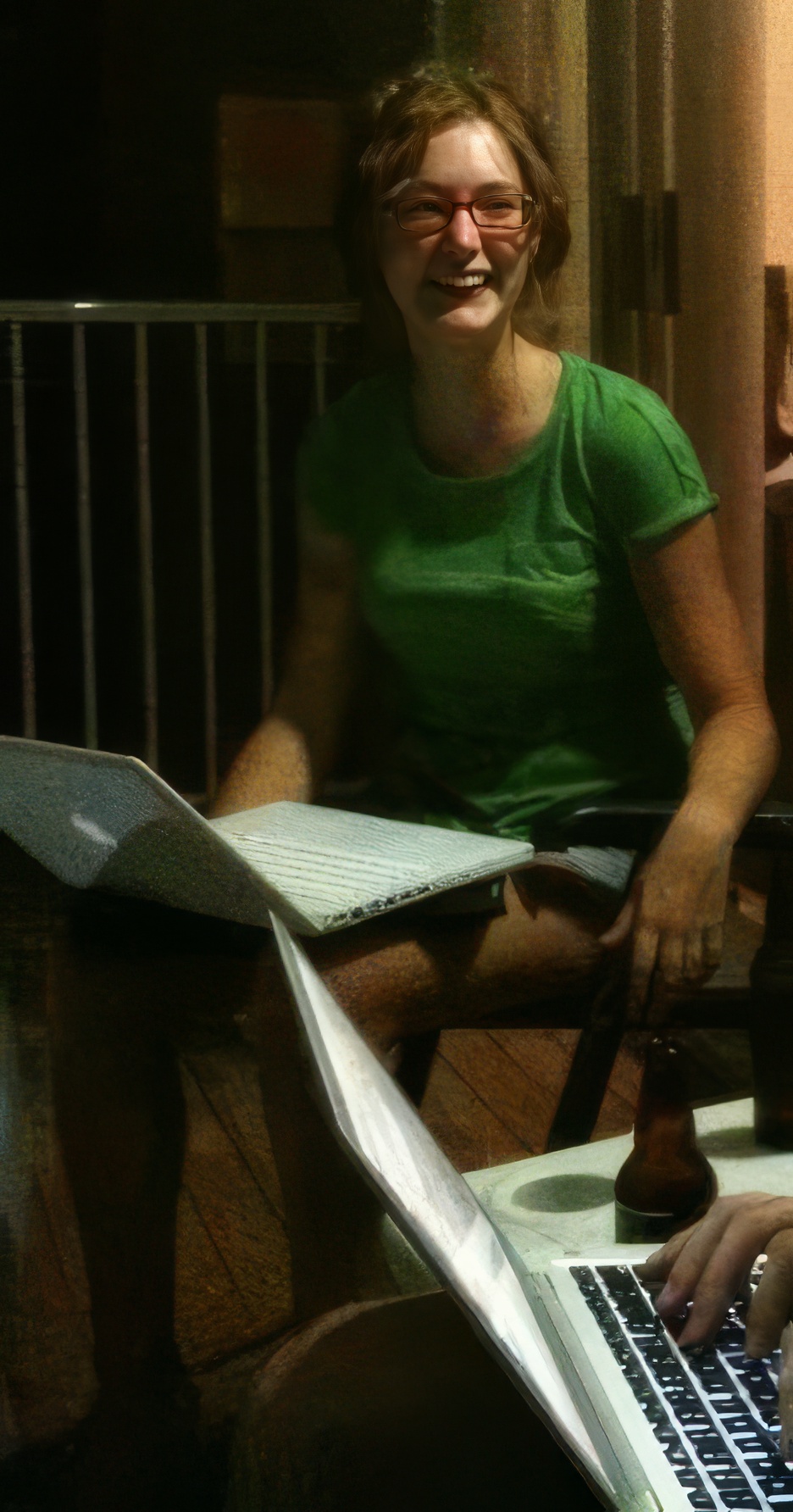 a woman sitting on a bench with a laptop