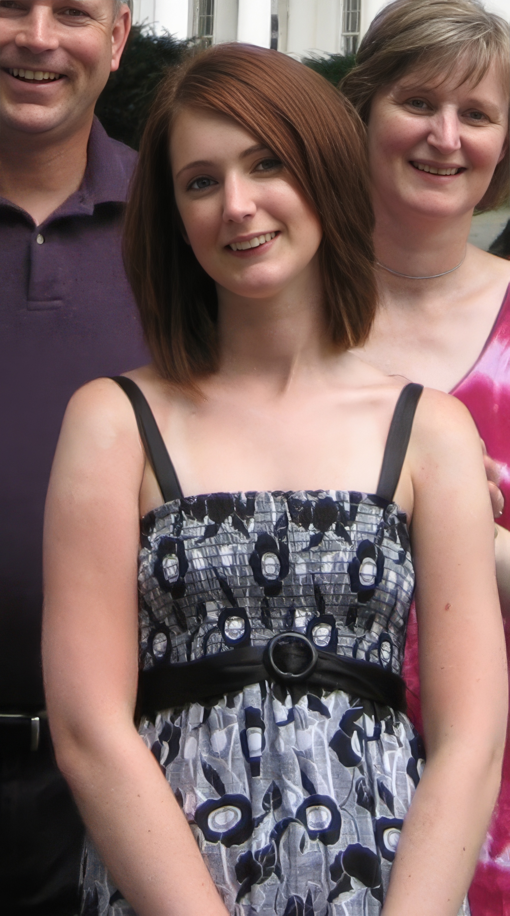 a woman wearing a black and white dress