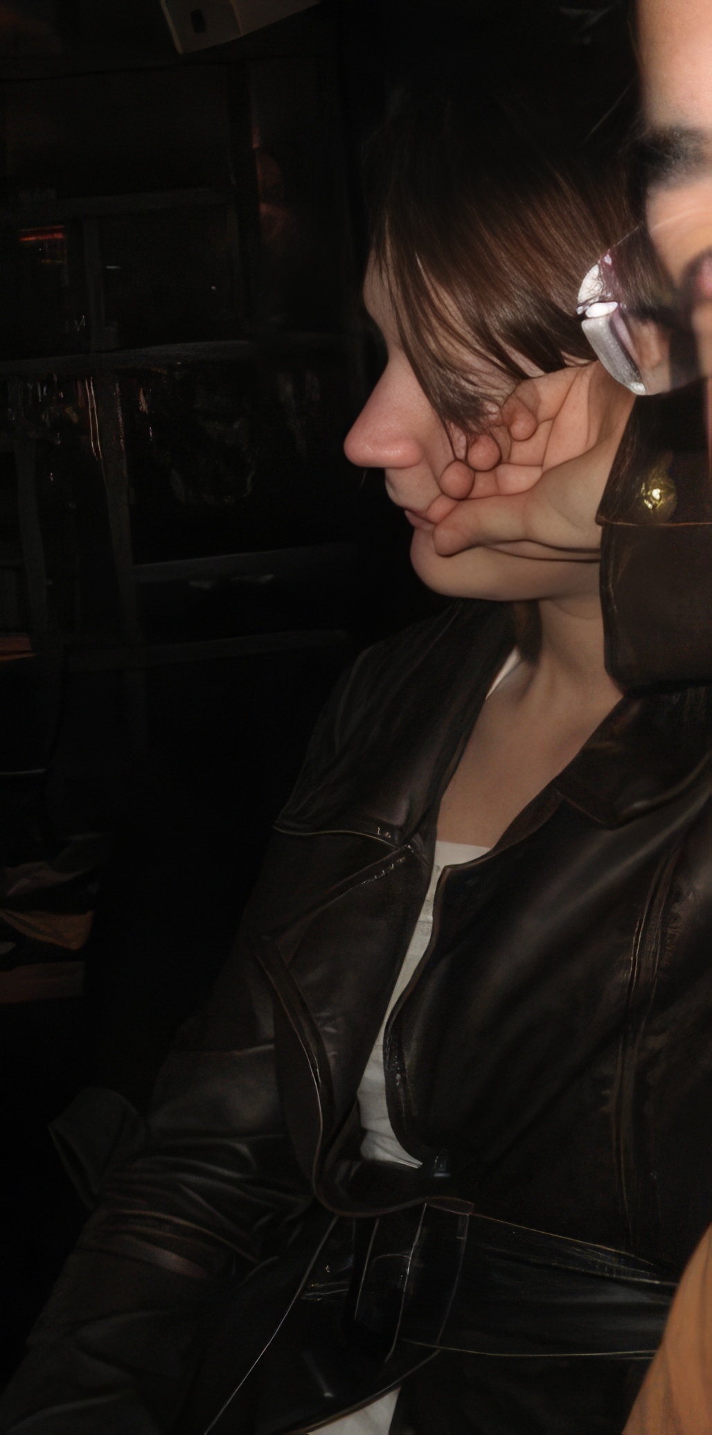 a woman wearing a leather jacket