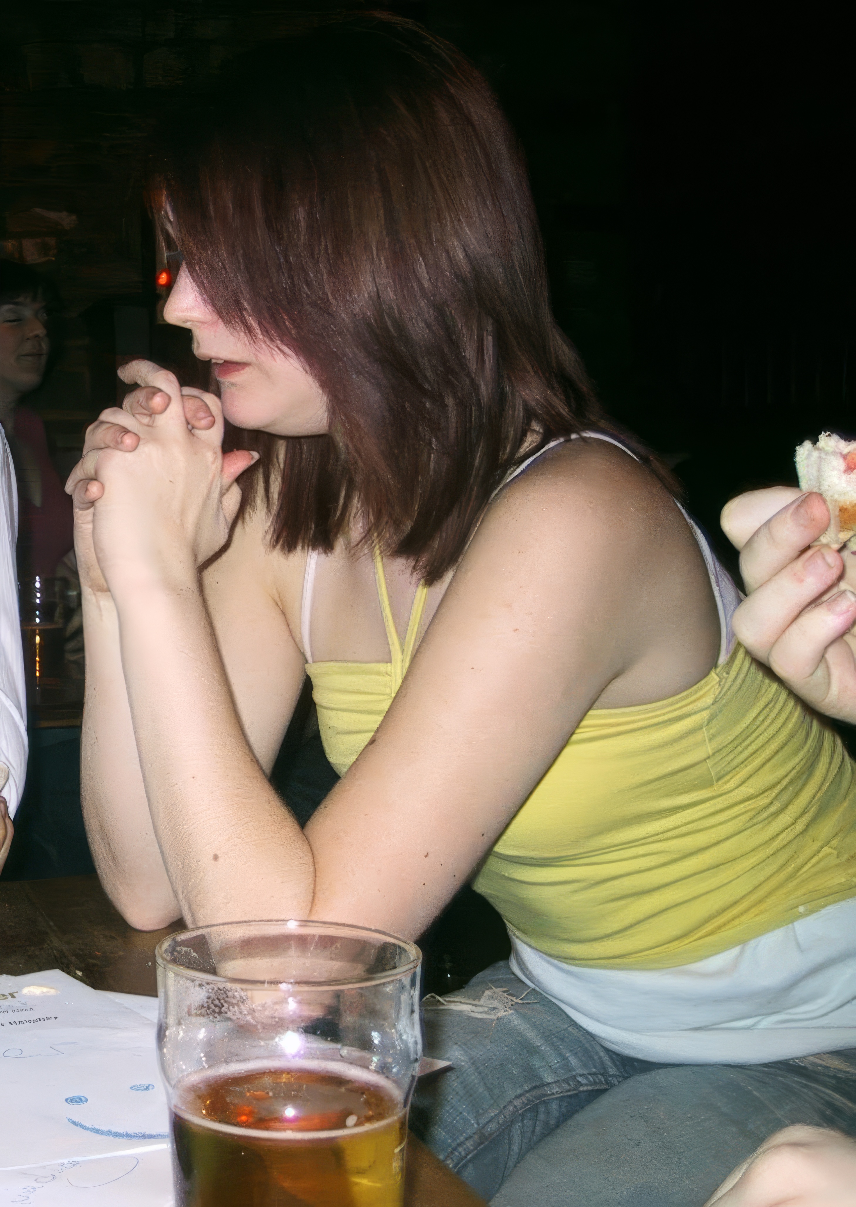 woman wearing a yellow tank top wie

ge NAINIONS