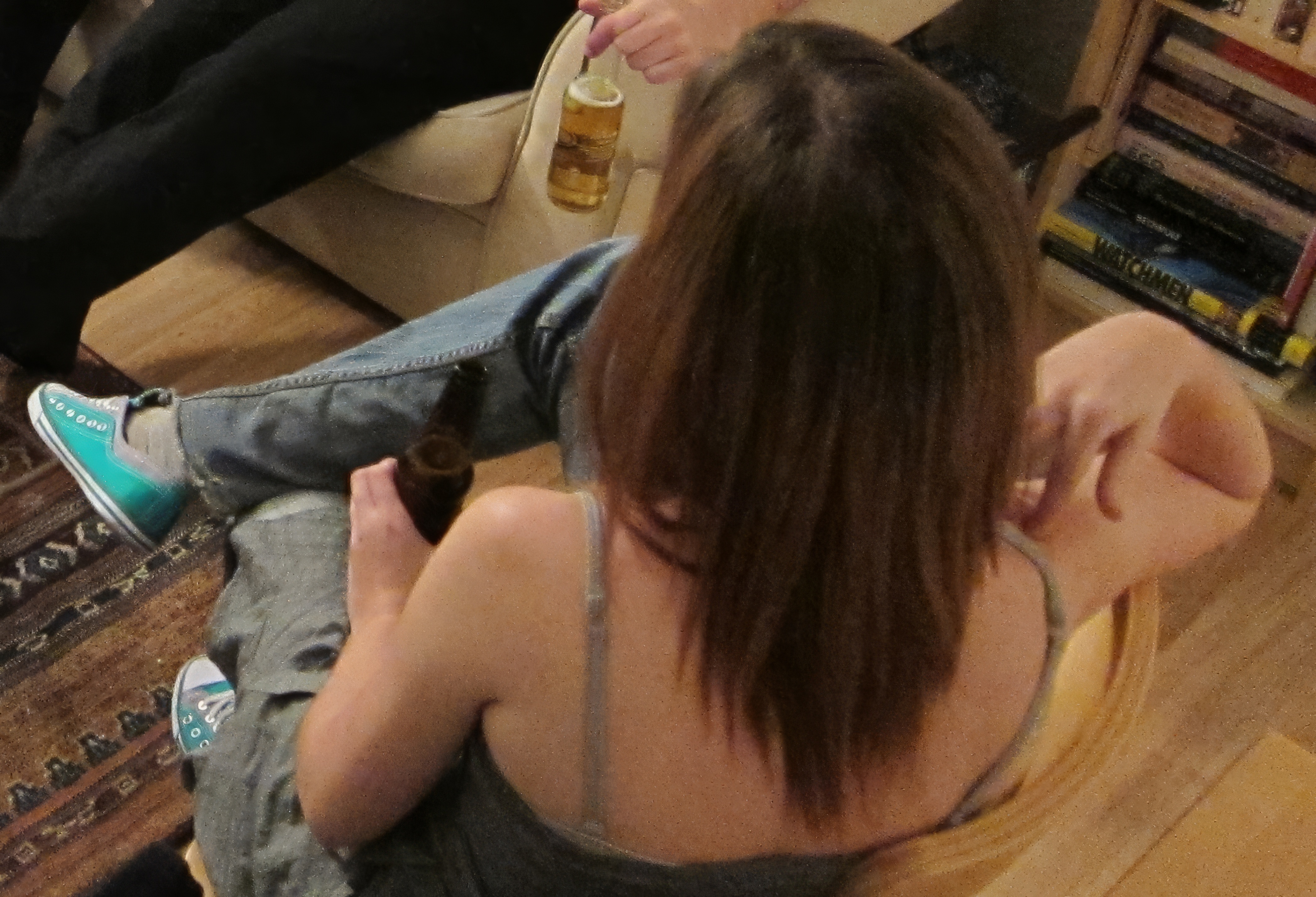 a woman sitting on the floor with a cellphone