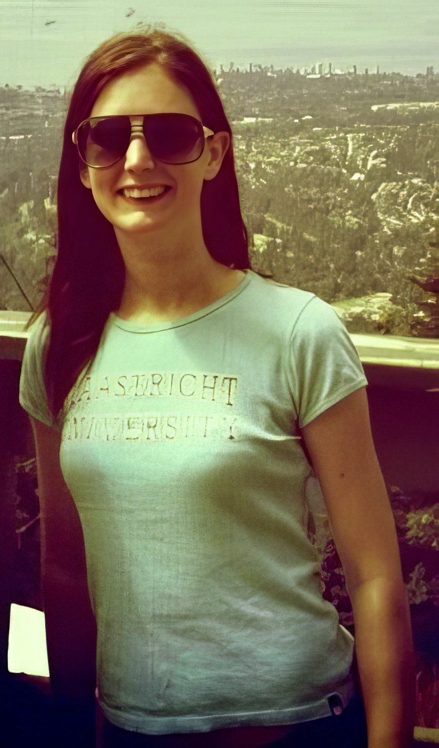 a woman wearing sunglasses and a shirt