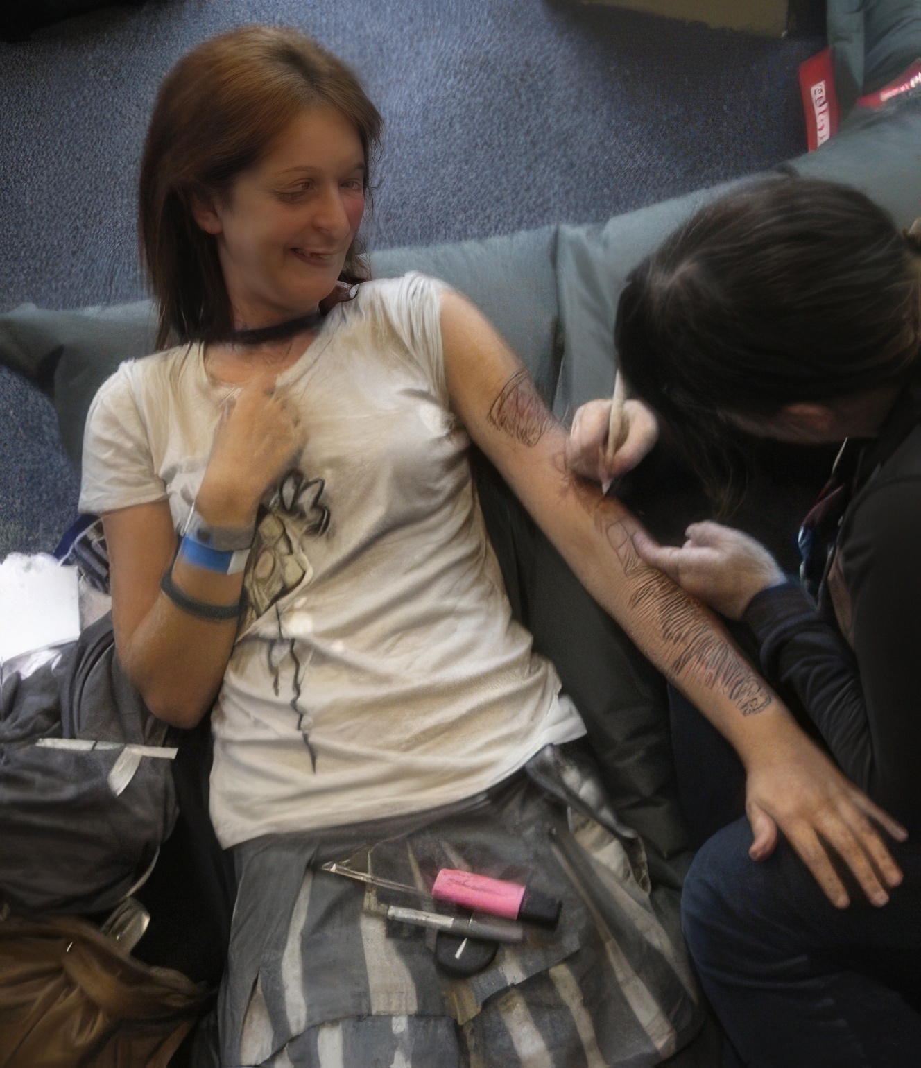 a woman with a tattoo on her arm