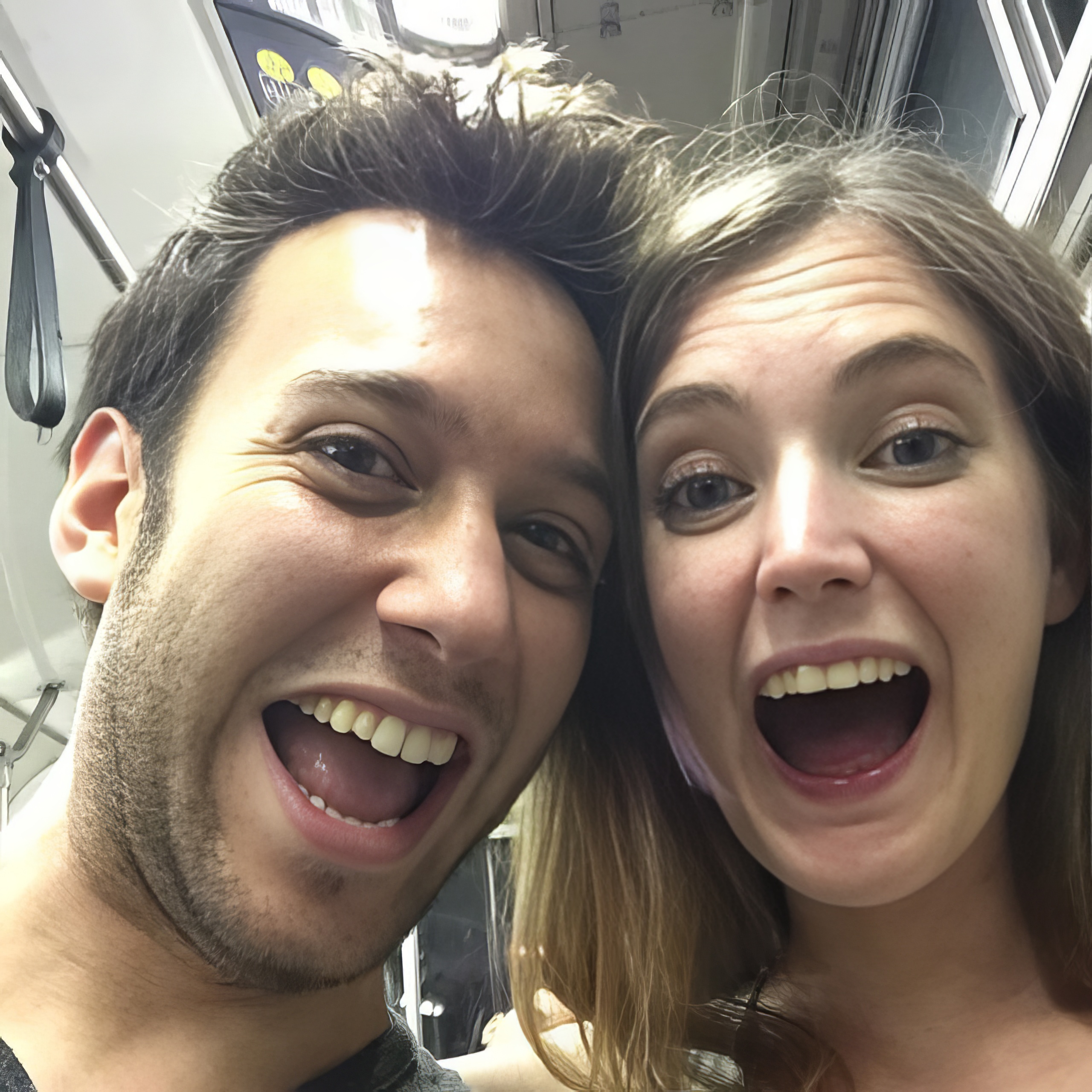 a man and woman are smiling and posing for a picture