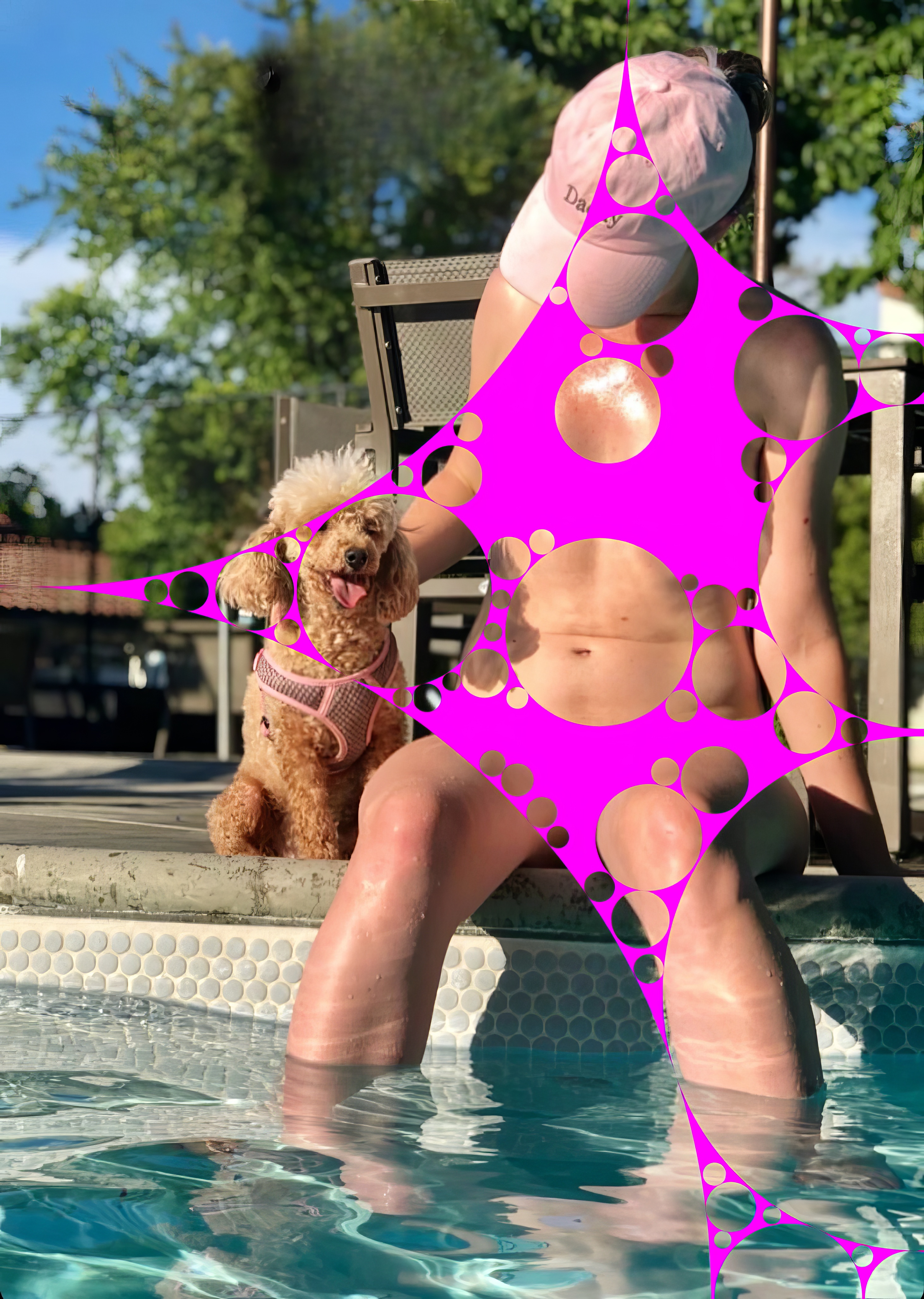 a woman in a pool with a dog