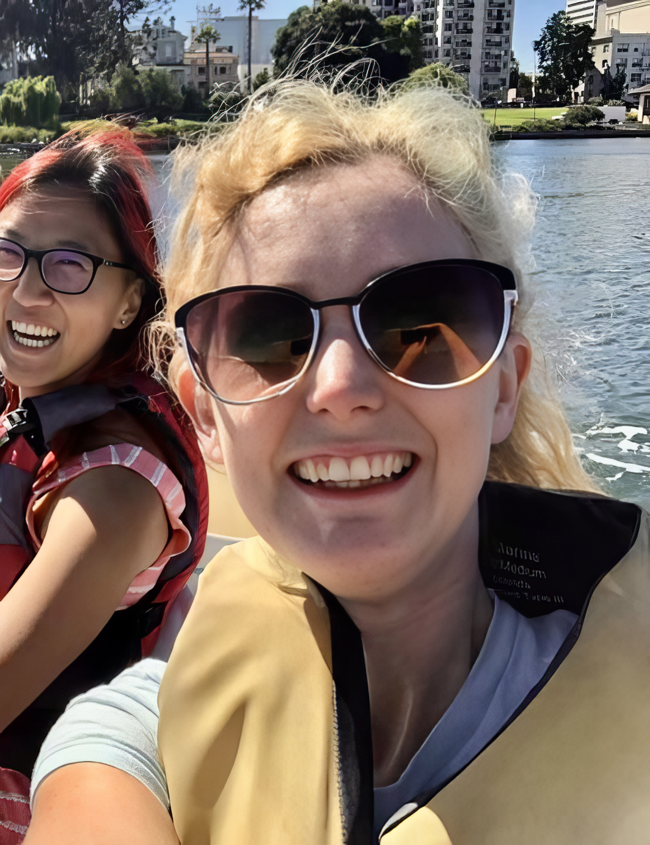 a woman and a girl riding a boat