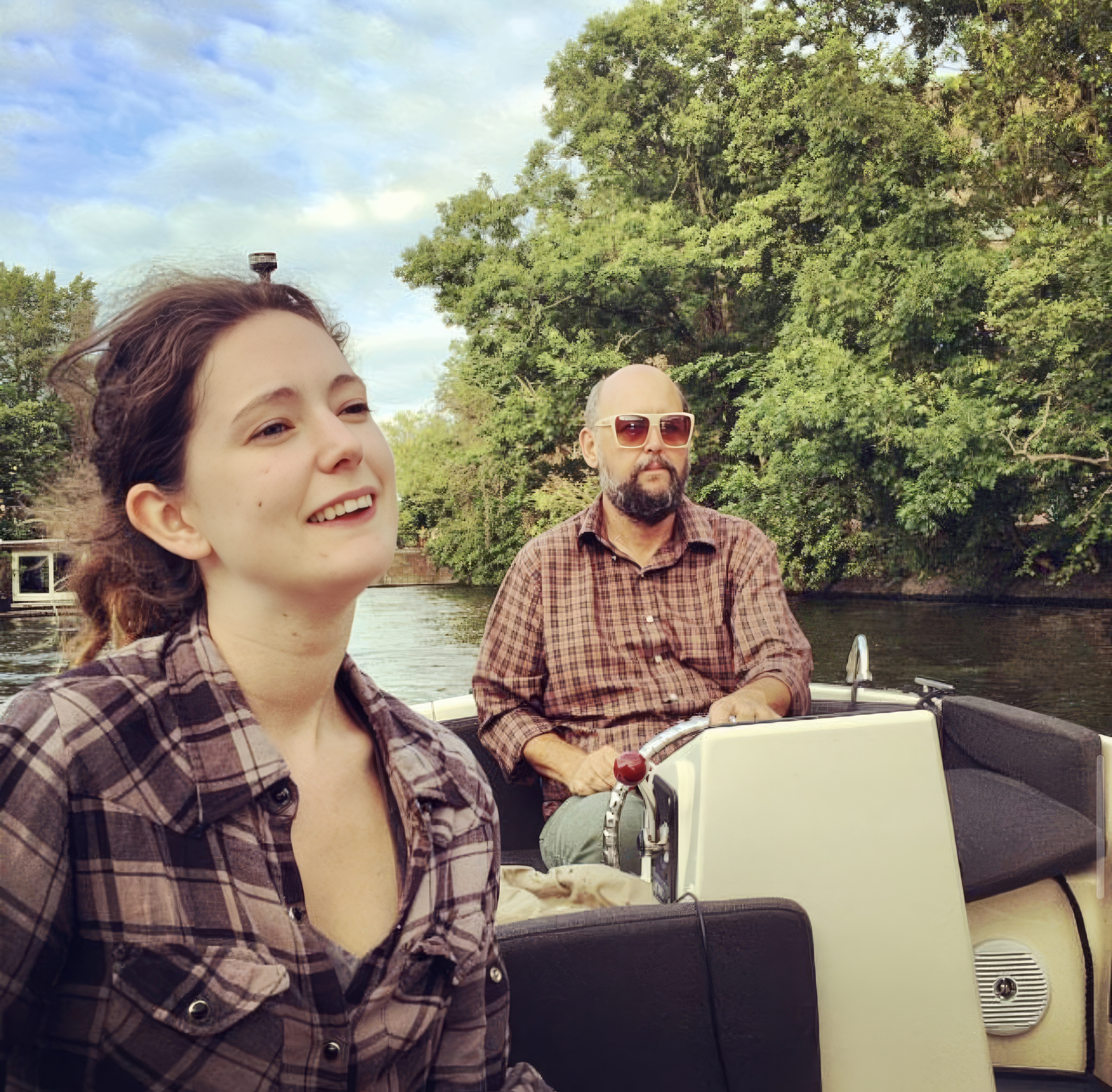 a man and woman are riding in a boat