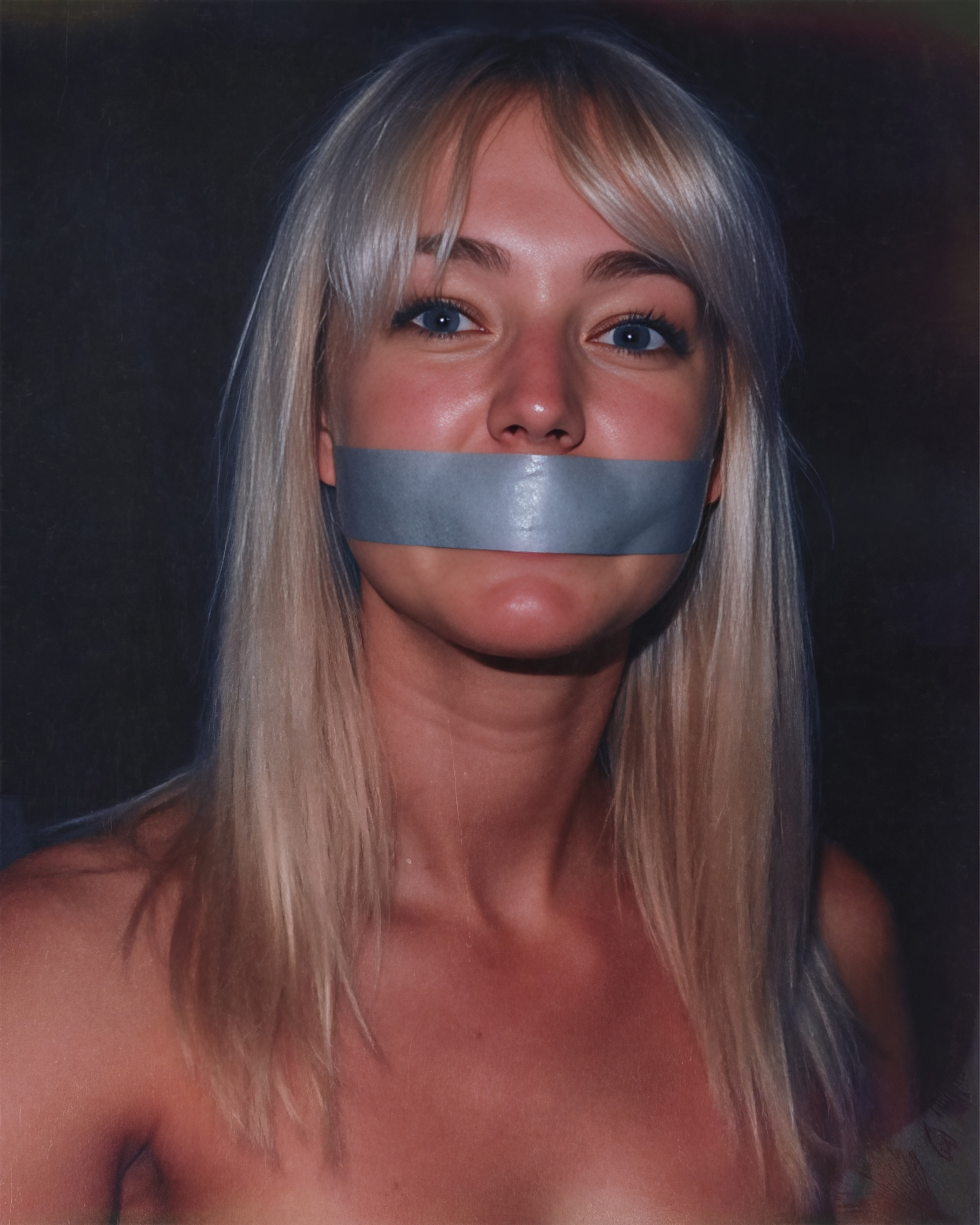 a woman with tape around her mouth