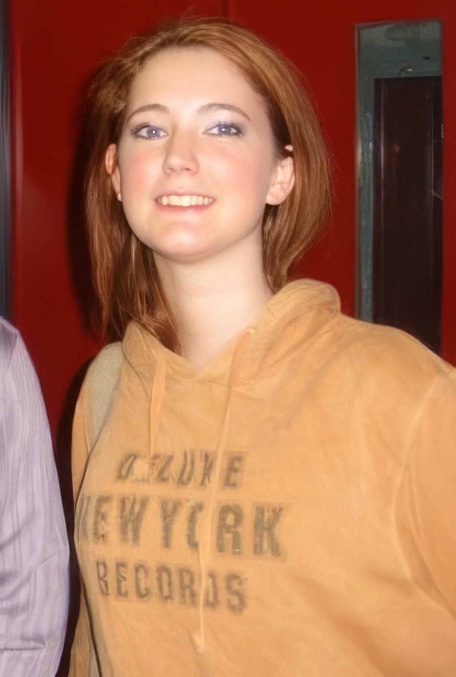 a woman with a brown hoodie