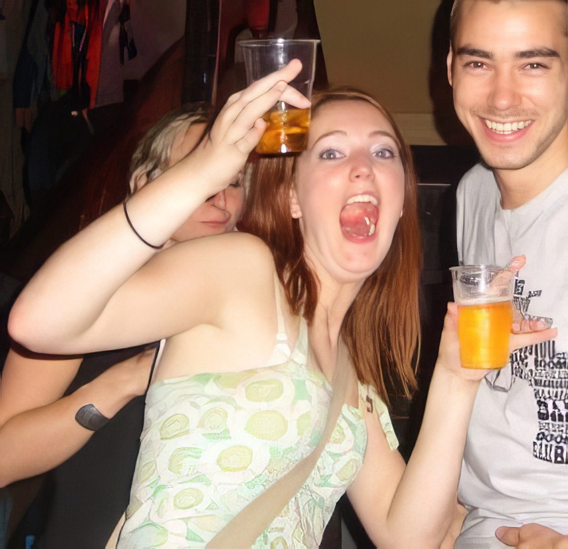 a man and a woman are drinking beer